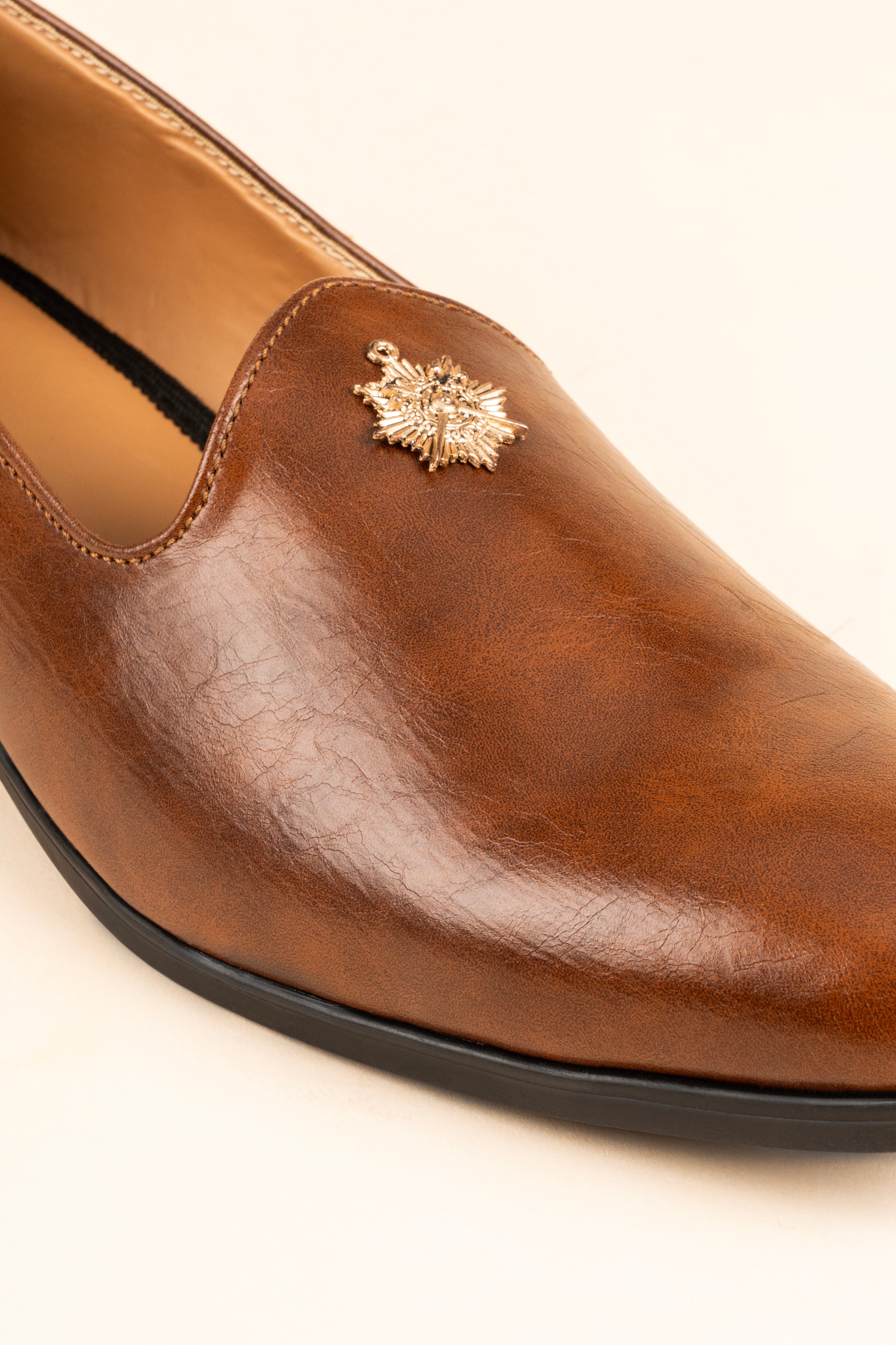 The Gold-Medallion Tan Loafer