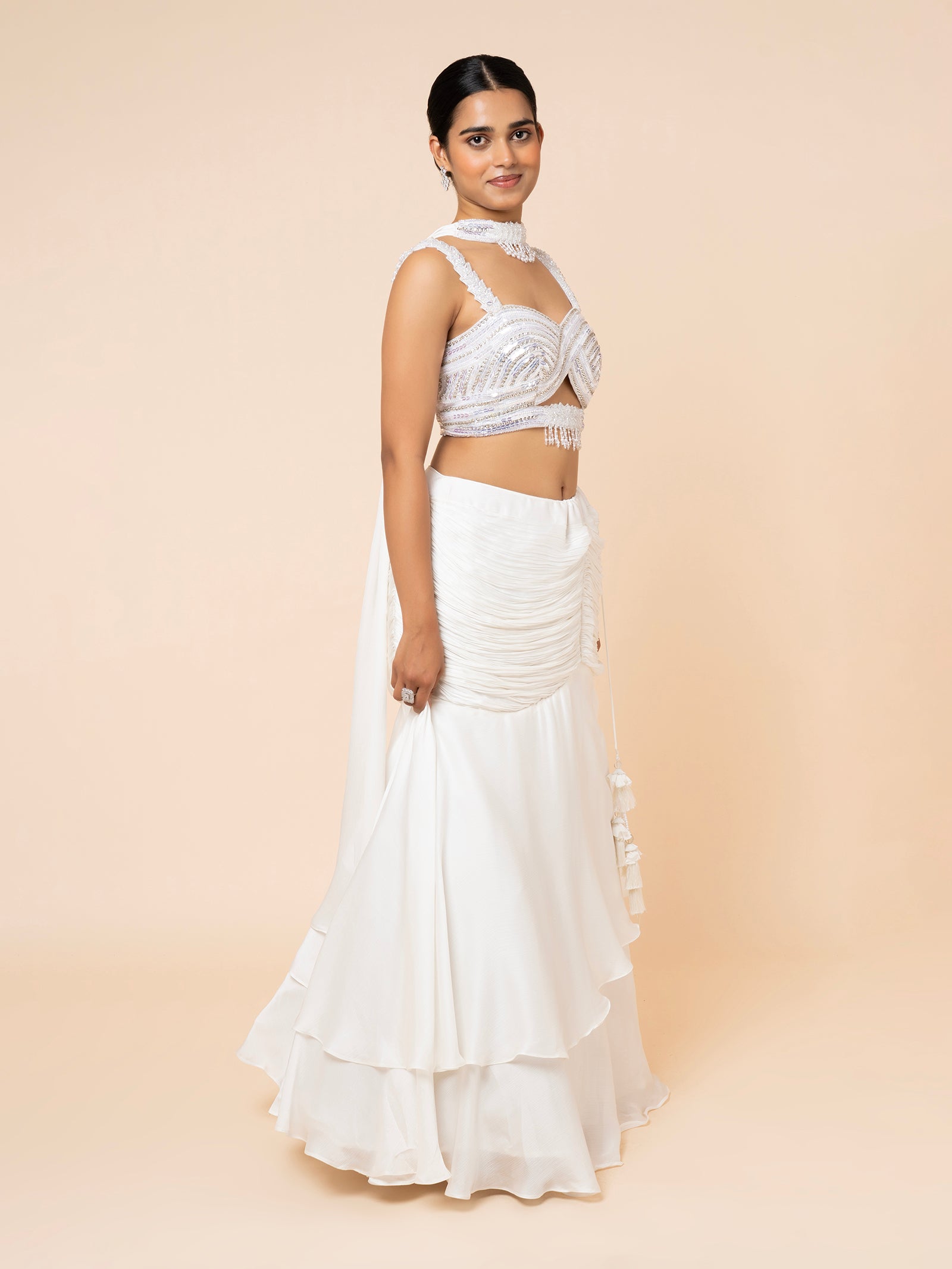 White Tiered Lehenga with Embellished Cut-out Blouse