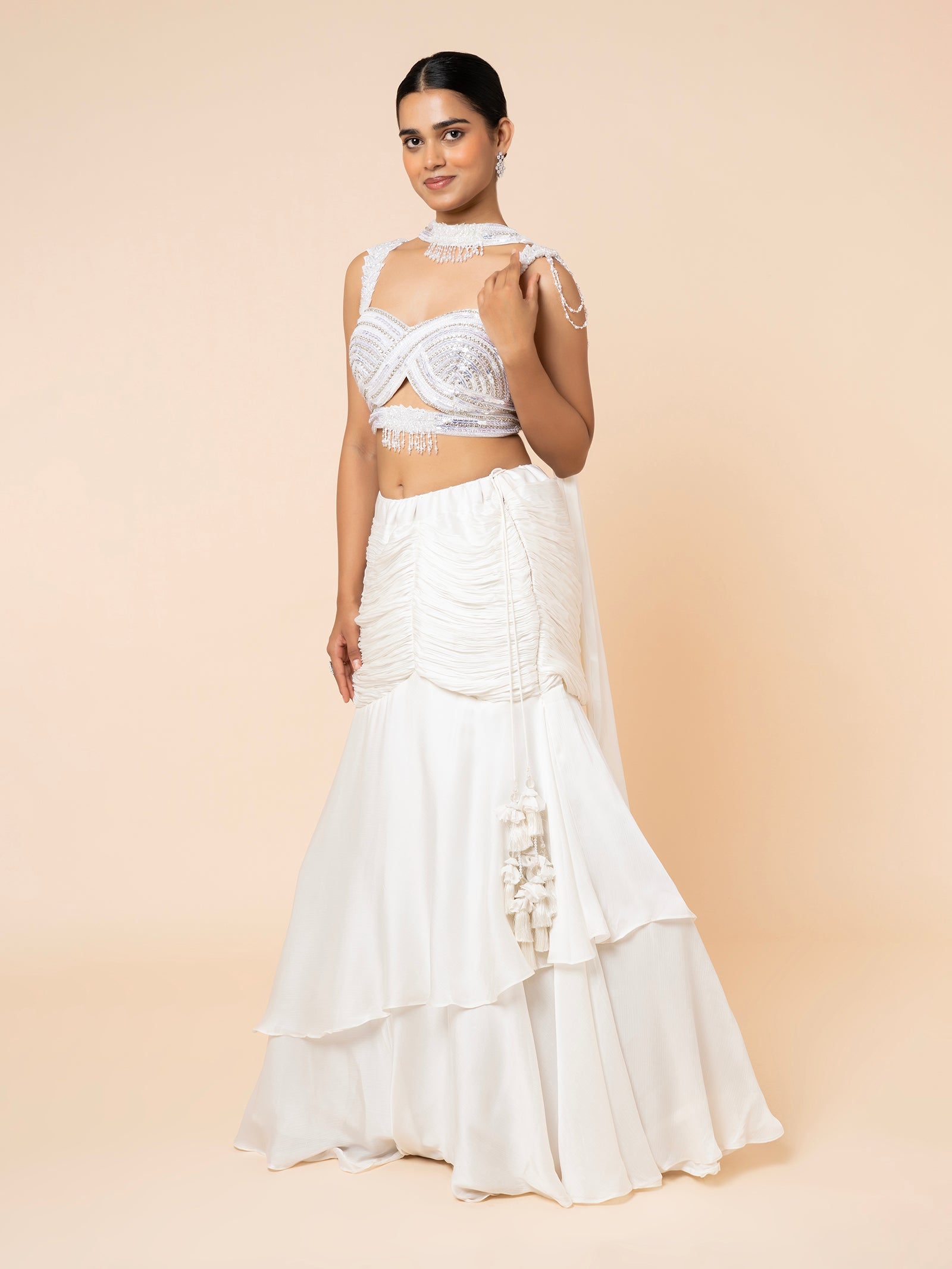 White Tiered Lehenga with Embellished Cut-out Blouse